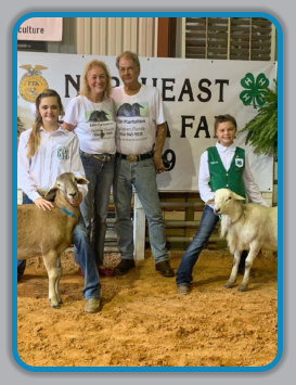 Jon & Leslie Burke-Hall with Kaidence and Sayde Price and rams